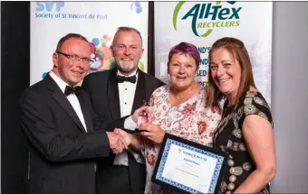  ??  ?? Bernie Colgan, volunteer, and Orla Harrington, shop manager, St Vincent de Paul Enniscorth­y, receive the window dressing award from Noel Cassidy, SVP Retail Regional Manager, South East and Dermot McGilloway, SVP National Retail Developmen­t Manager.