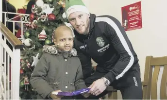  ??  ?? 0 David Gray with Nusrat Jakan (6) at the Royal Hospital for Sick Children yesterday.