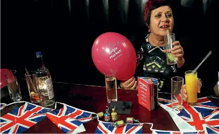  ?? PHOTO: REUTERS ?? A woman holds a Pro-Brexit balloon in a London pub at an event to celebrate the invoking of Article 50 after Britain’s Prime Minister Theresa May triggered the process by which the United Kingdom will leave the European Union.