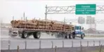  ?? — Reuters ?? A truck carrying logs heads toward the Canada border in Champlain, US.