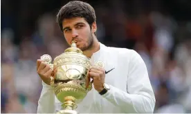  ?? Photograph: Tom Jenkins/The Guardian ?? Carlos Alcaraz kisses the famous trophy on Centre Court.