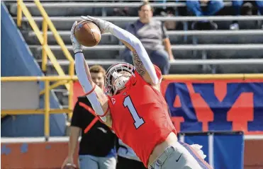  ?? DAVID JABLONSKI / STAFF ?? Dayton safety Brandon Easterling intercepts a pass against Presbyteri­an last season at Welcome Stadium. Easterling went undrafted but still envisions a career for himself playing pro football.