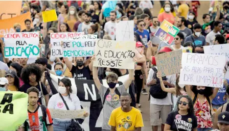  ?? — AFP photo ?? Students participat­e in a demonstrat­ion in defence of democracy and justice and against Bolsonaro in Brasília, Brazil.