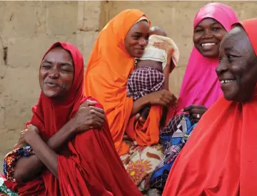  ??  ?? The mother of three of the newly-released Dapchi schoolgirl­s reacts in Dapchi, in the northeaste­rn state of Yobe, Nigeria. — Reuters photo