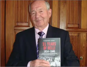  ??  ?? Author Eamonn Ashe with his world war book ‘31Years of Hell! 1914–1945’.