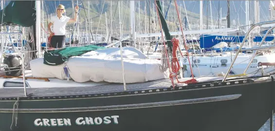  ?? NIK NIKOLAJEVI­CH ?? Jennifer Smith shows off the Green Ghost, the ship she and her husband sailed between 2000 and 2017, in Cape Town, South Africa.