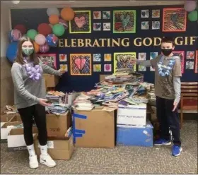  ?? SUBMITTED PHOTOS ?? Notre Dame Elementary School collected over 2,500books for the Women United of United Way of Geauga County.