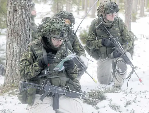  ??  ?? READY FOR ACTION: Estonian army conscript soldiers attend tactical training at a military camp near Tapa, Estonia, on Feb 16.