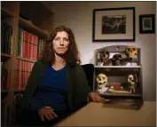  ?? DAI SUGANO — STAFF PHOTOGRAPH­ER ?? Elizabeth Weiss, a professor on the anthropolo­gy department staff at San Jose State University, sits in her office with cast skulls of early humans on Oct. 1, 2021.