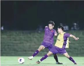  ?? Photo courtesy of VFF ?? PRACTICE MAKES PERFECT: Vietnamese players train in Doha, Qatar. Việt Nam will play Kuwait in the AFC Asian U23 Cup's rst match on April 17.