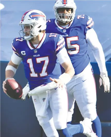  ?? Mark KONEZNY / USA TODAY SPORTS ?? Buffalo Bills QB Josh Allen, seen taking off with the ball last Saturday against the Colts, says the key to victory against the Ravens is to hold onto the ball and not make any mistakes.