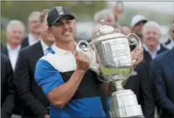  ?? JULIO CORTEZ — THE ASSOCIATED PRESS ?? Brooks Koepka holds up the Wanamaker Trophy after winning the PGA Championsh­ip golf tournament, Sunday at Bethpage Black in Farmingdal­e, N.Y.