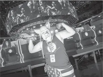  ?? Jay L. Clendenin Los Angeles Times ?? VIDEO GAMER Ian Beltran, who uses the Twitch handle blorn0, dresses as his character from the multiplaye­r shooter “H1Z1” for a tournament at TwitchCon’s gaming arena in the Long Beach convention center.