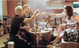  ??  ?? Simon (Jonny Lee Miller), Mark (Ewan McGregor) and Veronika (Anjela Nedyalkova) drink in Simon’s flat in ‘T2 Trainspott­ing’.