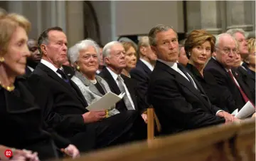  ??  ?? 02 FOUR PRESIDENTS AND A FUNERAL President George W Bush and his wife Lauren look across to a grieving Nancy Reagan at her husband’s funeral in 2004 02