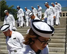  ?? Associated Press ?? ■ Incoming plebes carry their belongings down a staircase during Induction Day at the U.S. Naval Academy in Annapolis, Md. An analysis released Tuesday shows the percentage of female students nominated by members of Congress for admission to U.S. service academies has been rising although men are still put forward at numbers nearly three times higher than women.