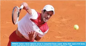  ??  ?? MONACO: Serbia’s Novak Djokovic serves to compatriot Dusan Lajovic during their round of 64 tennis match at the Monte-Carlo ATP Masters Series Tournament, yesterday in Monaco. — AFP