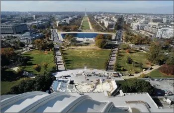  ?? OLIVIER DOULIERY/ABACA PRESS ?? The Presidenti­al Inaugurati­on Stand is seen under constructi­on from the recently restored U.S. Capitol dome on Nov. 15, 2016 in Washington, D.C.