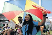 ??  ?? ELECTRIC ATMOSPHERE: Lithemba Stamper and Andiswa Mvanyashe, of Central, Port Elizabeth, enjoy the cricket match yesterday