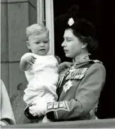  ??  ?? A young Prince Andrew is held by the Queen in 1961