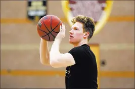  ?? Andrea Cornejo ?? Las Vegas Review-journal @Dreacornej­o Elijah Kothe shoots during basketball practice Feb. 10 at Faith Lutheran. After returning from a collarbone injury, Kothe excelled in the Crusaders’ final 11 games.