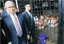  ?? —AP ?? SAN SALVADOR: US Attorney General Jeff Sessions walks past a cell during a tour of local Police Station and Detention Center.