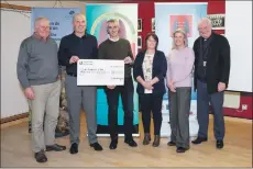  ??  ?? The £20,000 cheque is handed over to Point FC. From left are, Roddy Munro, vice-chair of Point Sport and Recreation Associatio­n, Point manager Angus ‘Stoodie’ Mackay receiving the cheque from Point and Sandwick Trust board member Donald ‘Buck’ Macdonald, PST board members Catherine Anne Smith and Jane Watson, and former Point player Kenny Nicholson.