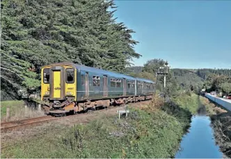  ?? ?? LEFT: Great Western Railway Class 150
DMU 150207 approaches St Blazey with 2N03, the 09.17 Newquay to
Par service on October 11, 2021.
David Barnsdale