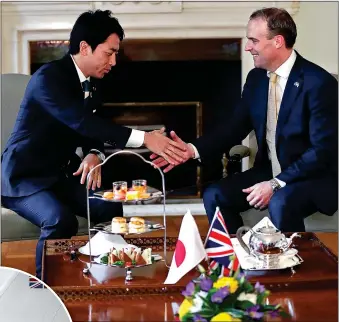  ?? Picture: ISSEI Kato/reuters ?? TRADING PLACES: Foreign Secretary Dominic Raab meets Japan’s Environmen­t Minister Shinjiro Koizumi in Tokyo yesterday, while Boris Johnson visited Berlin last month