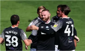  ??  ?? Wayne Rooney is congratula­ted after scoring the opener at Deepdale. Photograph: Alex Livesey/Getty Images