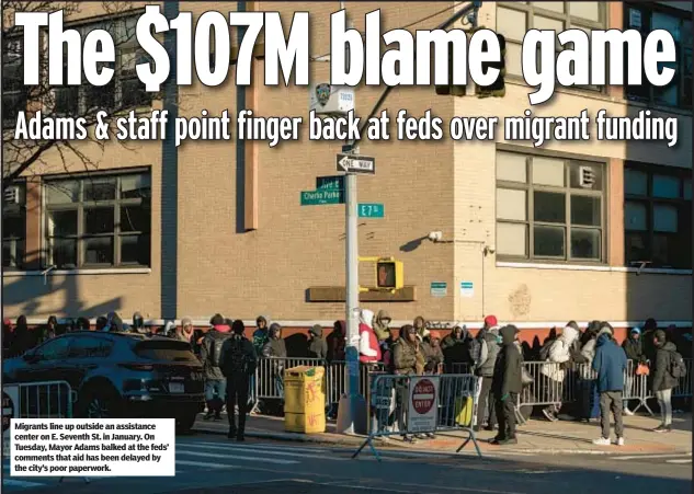  ?? ?? Migrants line up outside an assistance center on E. Seventh St. in January. On Tuesday, Mayor Adams balked at the feds’ comments that aid has been delayed by the city’s poor paperwork.