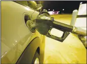  ?? DAVID ZALUBOWSKI / AP ?? A vehicle takes on fuel at a convenienc­e store Oct. 23 in Monument, Colo. Gasoline has hit its highest cost per gallon in seven years, helping spur a rise in the inf lation rate.
