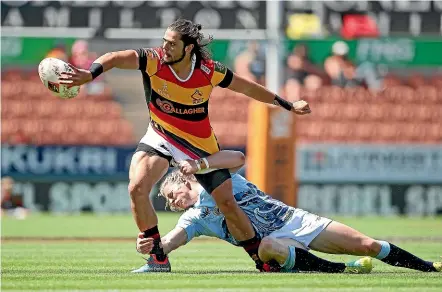  ?? GETTY IMAGES ?? Waikato’s Matt Lansdowne offloads the ball under pressure from Northland’s Scott Gregory during Saturday’s Mitre Cup Championsh­ip semifinal in Hamilton.