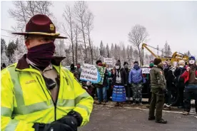  ?? Photograph: Kerem Yücel/AFP/Getty Images ?? Environmen­tal activists protest in front of the constructi­on site for the Line 3 oil pipeline site in 2021.