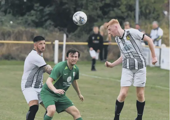  ??  ?? Boldon CA (stripes) in action against Easington CW, on Saturday