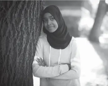  ??  ?? Amal Absiye, a Grade 11 student leader at Jarvis Collegiate Institute, embraces the opportunit­y to be a role model.