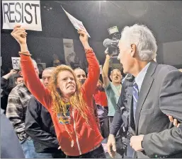  ??  ?? She will not be ignored: A protester at GOP Rep. Tom McClintock’s townhall meeting, during which the congressma­n was pressed on health care.