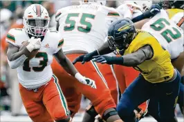  ?? DUANE BURLESON / ASSOCIATED PRESS ?? Miami running back DeeJay Dallas had 17 carries for a career-high 110 yards against Toledo on Saturday.