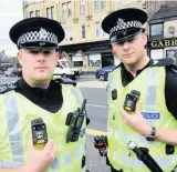  ??  ?? On the beat Sergeants David Cameron and Chris Daly with the hi-tech body cams