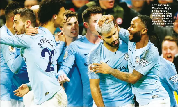  ?? PICTURE: PA Images ?? CITY SLICKERS: Manchester City’s Sergio Aguero celebrates scoring their opener in the 2-1 win against Liverpool on Thursday with his team-mates