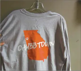  ?? Tricia Cambron/SJ ?? The t-shirt Adams designed for sale to the general public has “Chubb Town” on the back and the number 27 on the front pocket.