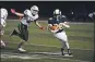  ?? OWEN MCCUE — MEDIANEWS GROUP ?? Spring-Ford’s Harry Adieyefeh (26) runs past Methacton’s Josh Cancro in the Rams’ 21-0 win on Friday.