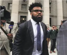  ?? Julie Jacobson / Associated Press ?? Cowboys running back Ezekiel Elliott walks out of federal court in New York without speaking to reporters.