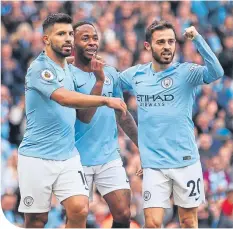  ??  ?? Raheem Sterling is congratula­ted after his goal