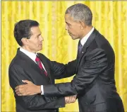  ?? PABLO MARTINEZ MONSIVAIS / AP ?? President Barack Obama and Mexican President Enrique Pena Nieto shake hands following their joint news conference in the East Room of the White House in Washington, D.C., on Friday.