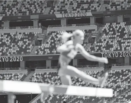  ?? Patrick Smith / Getty Images ?? Almost all of the seats at Tokyo’s Olympic venues went unfilled as fans were kept out amid a worsening COVID-19 pandemic.