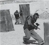  ??  ?? Men play paintball in Kabul, Afghanista­n.