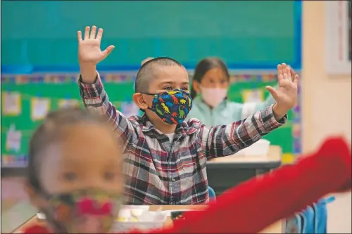  ?? (AP/Jae C. Hong) ?? Kindergart­en students participat­e in a classroom activity on the first day of in-person learning at Maurice Sendak Elementary School in Los Angeles.