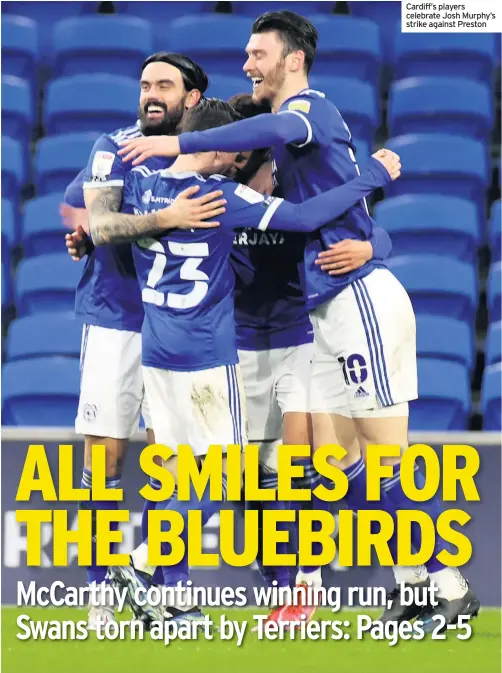  ??  ?? Cardiff’s players celebrate Josh Murphy’s strike against Preston