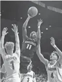  ?? JACOB SNOW/USA TODAY SPORTS ?? Gonzaga guard Joel Ayayi (11) shoots the ball against Arizona in the first half Saturday at McKale Center.